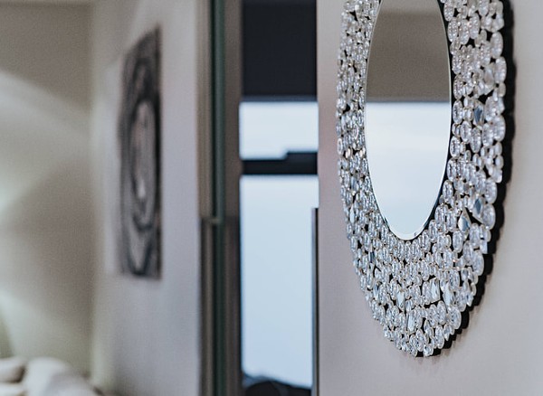 round mirror frame on wall