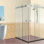 Corner glass shower enclosure with sliding doors