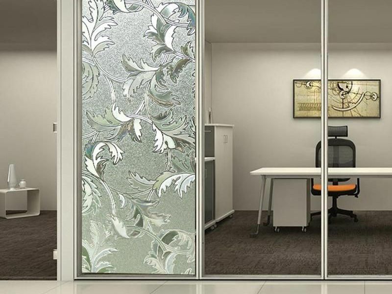 Sliding glass partition with decorative etched patterned panel
