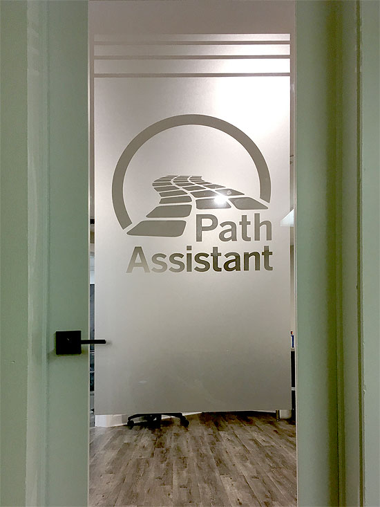 Frosted glass office door with logo and branding