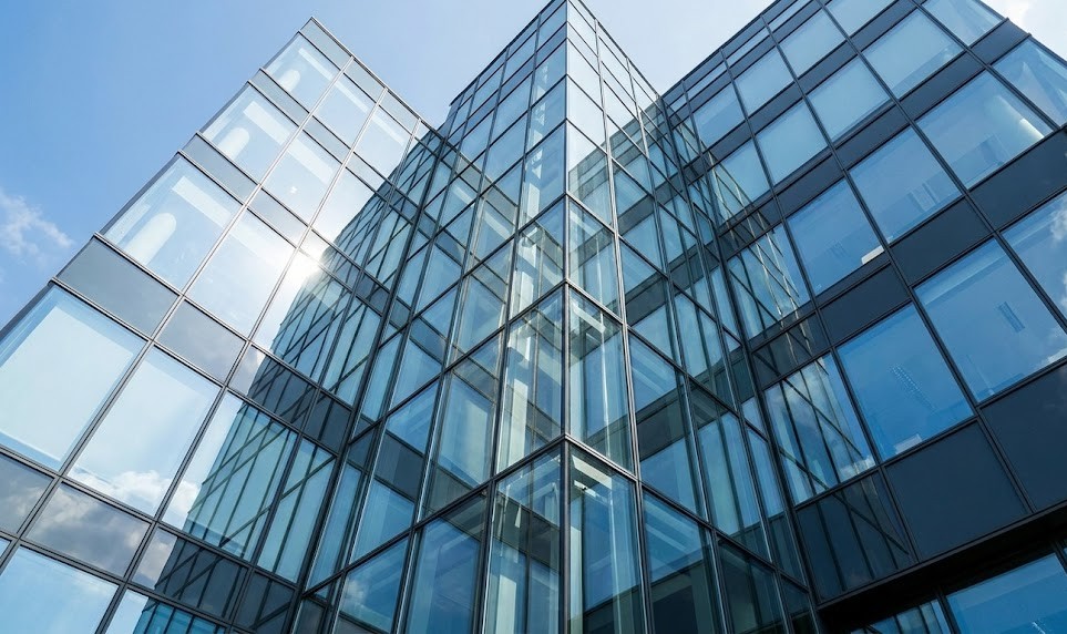 Modern glass building facade with reflective panels
