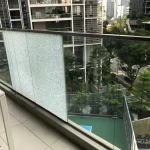 Shattered Balcony glass railing with a frosted privacy panel